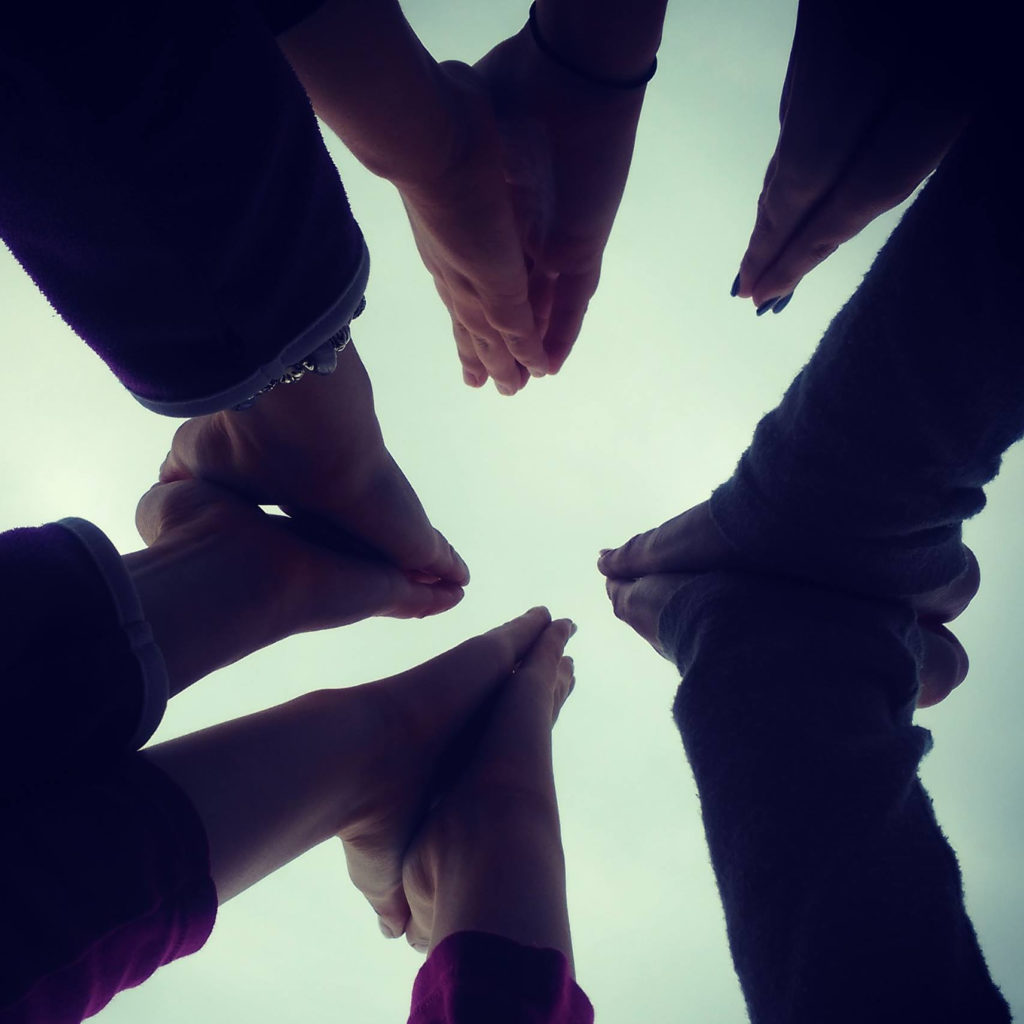 People joining hands together