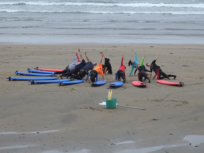 people exercising on the beach