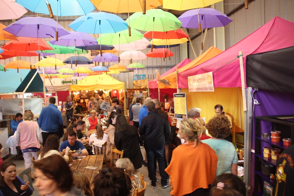 people walking under umbrellas
