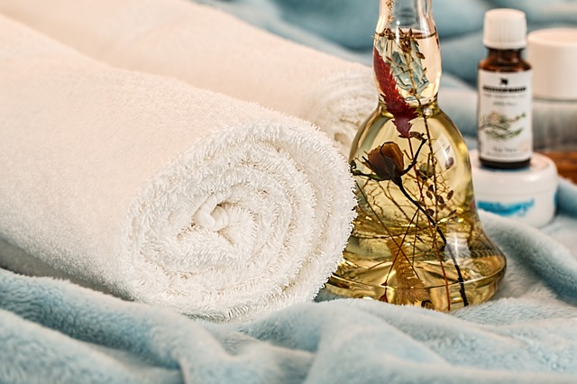 white towel and massage oil